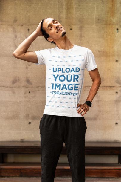 Bella Canvas T-Shirt Mockup Featuring a Man Stretching His Head for a Yog