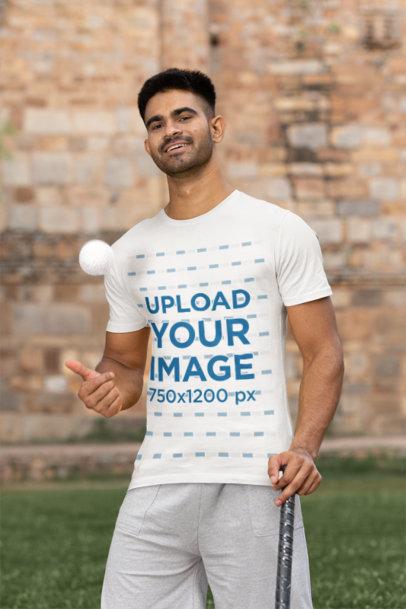 Mockup of a Cricket Player Wearing a T-Shirt and Throwing a Ball into the Air