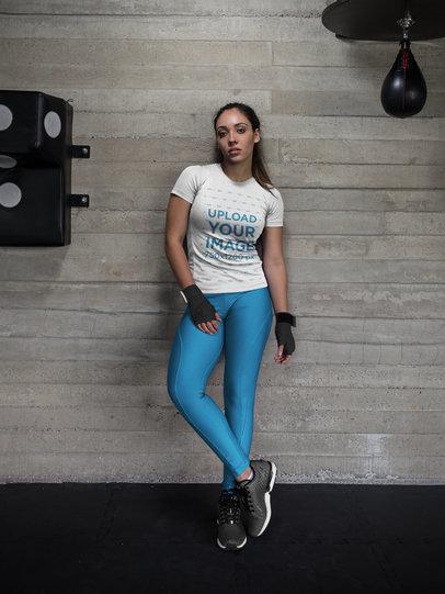 Mockup of a Woman at the Gym Wearing Hand Wraps and Custom Sportswear