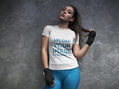 Sports Mockup of a Woman at the Locker Room Wearing Custom Sportswear and Boxfit Hand Gloves